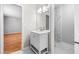 Bathroom featuring a vanity with a large mirror and a view to the tiled shower at 4347 Pleasant Ridge Rd, Decatur, GA 30034