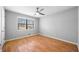 Bedroom with hardwood floors, ceiling fan, and window providing natural light at 4347 Pleasant Ridge Rd, Decatur, GA 30034
