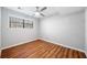 Bright bedroom with wood floors, neutral walls, and natural light from the window at 4347 Pleasant Ridge Rd, Decatur, GA 30034