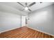 This bedroom has wood floors, a ceiling fan, and is painted with neutral colors at 4347 Pleasant Ridge Rd, Decatur, GA 30034