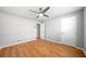 Bedroom with hardwood floors, ceiling fan, and white doors at 4347 Pleasant Ridge Rd, Decatur, GA 30034