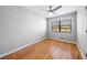 Bright bedroom features hardwood floors, a ceiling fan, and a large window for natural light at 4347 Pleasant Ridge Rd, Decatur, GA 30034