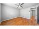 Bedroom with hardwood floors, ceiling fan, and view to the hallway at 4347 Pleasant Ridge Rd, Decatur, GA 30034
