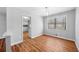 Bright dining room with modern lighting, wood flooring, and a large window at 4347 Pleasant Ridge Rd, Decatur, GA 30034