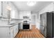 Well-lit kitchen with granite countertops, stainless appliances, and ample storage at 4347 Pleasant Ridge Rd, Decatur, GA 30034