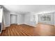 Open-concept living room features hardwood floors, neutral wall colors, natural light and modern ceiling light fixture at 4347 Pleasant Ridge Rd, Decatur, GA 30034