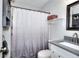 This bathroom features granite countertops and a shower with a shower curtain at 679 Suwanee Ct, Lawrenceville, GA 30043