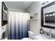 This bathroom includes granite countertops and a shower with a shower curtain at 679 Suwanee Ct, Lawrenceville, GA 30043