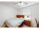 This bedroom features a ceiling fan and a wooden headboard at 679 Suwanee Ct, Lawrenceville, GA 30043