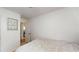 Cozy bedroom featuring neutral walls and white trim with attached bathroom at 679 Suwanee Ct, Lawrenceville, GA 30043