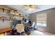 Bedroom featuring shelves, two desks, ceiling fan, and natural light at 679 Suwanee Ct, Lawrenceville, GA 30043