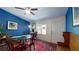Bright dining area features a vibrant blue wall and a large window offering natural light at 679 Suwanee Ct, Lawrenceville, GA 30043