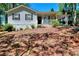 Quaint home with a charming front porch, cozy curb appeal, and a lush yard at 679 Suwanee Ct, Lawrenceville, GA 30043