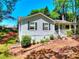 Well-maintained home featuring classic siding, dark shutters, and a welcoming covered front porch at 679 Suwanee Ct, Lawrenceville, GA 30043