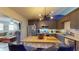 Open kitchen flowing into the living area, featuring stainless steel appliances and ample counter space at 679 Suwanee Ct, Lawrenceville, GA 30043