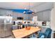 Charming kitchen features gray cabinetry, stainless steel appliances, and a stylish light fixture at 679 Suwanee Ct, Lawrenceville, GA 30043