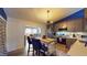 Open-concept kitchen with stainless appliances flows into the living room, perfect for entertaining at 679 Suwanee Ct, Lawrenceville, GA 30043
