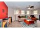 Bright living room boasts wood laminate flooring, recessed lighting, and a ceiling fan at 679 Suwanee Ct, Lawrenceville, GA 30043