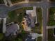 Aerial view of a luxury home with a spacious backyard, wood deck, stone patio, and fire pit at 903 Shaftoe Nw St, Kennesaw, GA 30152