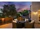 Beautifully landscaped backyard features a wood deck, comfortable seating around a fire pit, and a well-manicured lawn at 903 Shaftoe Nw St, Kennesaw, GA 30152