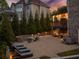 Inviting backyard patio with comfortable seating around a fire pit, ideal for outdoor entertaining at 903 Shaftoe Nw St, Kennesaw, GA 30152