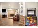 Finished basement with arcade games, bar decor, sitting area, and wood floors create a fun entertainment space at 903 Shaftoe Nw St, Kennesaw, GA 30152