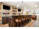 Finished basement with a bar, brick accents, and mounted TVs at 903 Shaftoe Nw St, Kennesaw, GA 30152