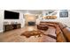 Finished basement area with comfortable sectional, TV, and brick wall that create a cozy entertainment space at 903 Shaftoe Nw St, Kennesaw, GA 30152