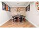 Basement features a poker table with seating, complemented by hardwood flooring and wall decor for a finished space at 903 Shaftoe Nw St, Kennesaw, GA 30152