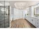 Spacious bathroom with double vanity, marble countertops, a shower, a tub and modern fixtures at 903 Shaftoe Nw St, Kennesaw, GA 30152