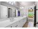 Bathroom with double sink and modern finishes at 903 Shaftoe Nw St, Kennesaw, GA 30152