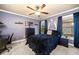 Comfortable bedroom with large window, ceiling fan, and plush bedding at 903 Shaftoe Nw St, Kennesaw, GA 30152