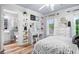 Bedroom features vanity, shelving, closet, and ensuite bathroom at 903 Shaftoe Nw St, Kennesaw, GA 30152
