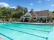 Large community pool with plenty of lounge chairs and covered seating for residents enjoyment at 903 Shaftoe Nw St, Kennesaw, GA 30152