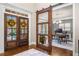 Beautiful home office view through stylish sliding barn door from the foyer, featuring modern decor and ample light at 903 Shaftoe Nw St, Kennesaw, GA 30152
