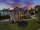 Beautiful home with lush landscaping and a cozy backyard fire pit area for outdoor gatherings at 903 Shaftoe Nw St, Kennesaw, GA 30152