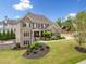 Attractive brick home with well-kept lawn, offering a blend of comfort and sophistication at 903 Shaftoe Nw St, Kennesaw, GA 30152