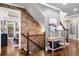 Welcoming hallway with hardwood floors, brick accents, and elegant decor at 903 Shaftoe Nw St, Kennesaw, GA 30152