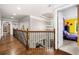 Bright hallway with hardwood floors and a staircase at 903 Shaftoe Nw St, Kennesaw, GA 30152