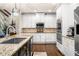 Spacious kitchen featuring stainless steel appliances, granite counters, and dark wood floors at 903 Shaftoe Nw St, Kennesaw, GA 30152
