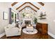 Inviting living room features a stone fireplace, neutral furniture, and decorative wallpaper at 903 Shaftoe Nw St, Kennesaw, GA 30152