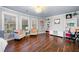 Bright living room featuring hardwood floors, neutral paint, and elegant furniture at 903 Shaftoe Nw St, Kennesaw, GA 30152