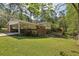Expansive backyard showcasing a large deck, carport, and plenty of space for outdoor activities at 1649 Clairmont Ne Way, Brookhaven, GA 30329