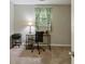Bedroom with light walls, carpet flooring, window with curtains, desk, printer, and black chair at 1649 Clairmont Ne Way, Brookhaven, GA 30329