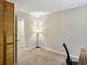 Bedroom with light walls and carpet flooring, closet doors, a lamp and office chair at 1649 Clairmont Ne Way, Brookhaven, GA 30329