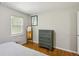 Bedroom with hardwood floors, dresser, and natural light at 1649 Clairmont Ne Way, Brookhaven, GA 30329