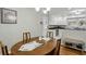 Bright dining room with a view to the kitchen with white cabinets at 1649 Clairmont Ne Way, Brookhaven, GA 30329