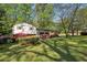 Charming two-story home with a lush front yard and colorful shrubbery at 1649 Clairmont Ne Way, Brookhaven, GA 30329