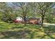 Charming home surrounded by mature trees and flowering shrubs, offering a serene and inviting atmosphere at 1649 Clairmont Ne Way, Brookhaven, GA 30329
