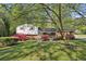 Charming two-story home with well-maintained lawn and colorful flowering bushes enhancing its curb appeal at 1649 Clairmont Ne Way, Brookhaven, GA 30329